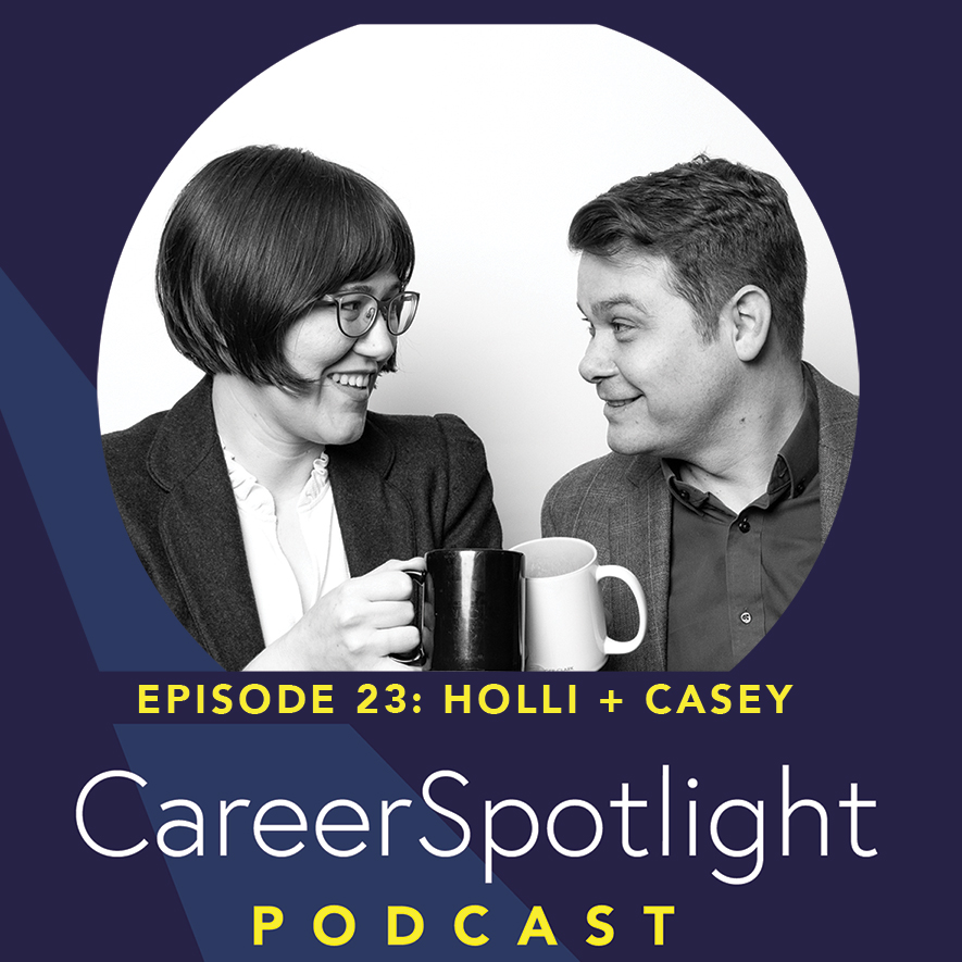 Black and White photo of Holli and Casey holding cups of coffee facing each other.