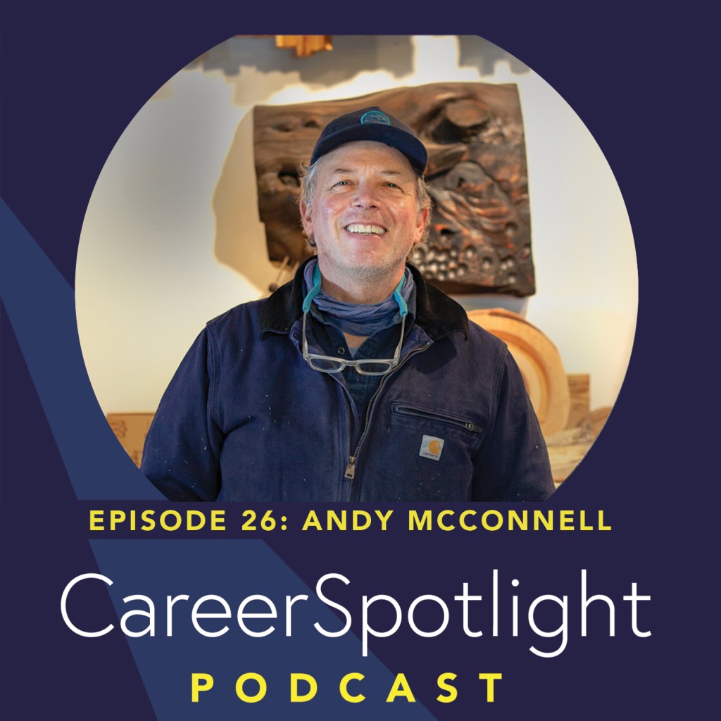 Artist Andy McConnell portrait looking at the camera in his workshop.